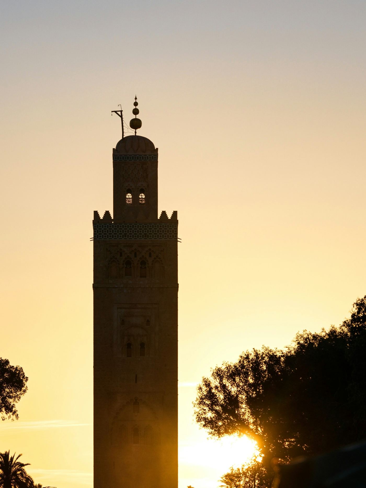 The Koutoubia minaret silhouetted against a golden Marrakech sunset